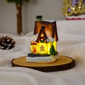 Close-up of a resin glowing Christmas village house with snow detail and warm LED light - Style F
