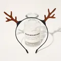 Close-up of brown plush reindeer antlers on a black headband for Christmas party - Christmas Antler Headband - Antler Coffee