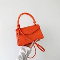 Minimalist bright orange pleated handbag with knot handle and shoulder strap - Orange