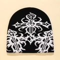 Berretto in maglia bianco e nero con motivi a croce astratti e design jacquard geometrico - Taglia unica / Nero e Bianco