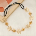 Detailed macro view of golden metal hairband with rhinestone floral and leaf ornaments - Golden with Gold Buckle (B1334)