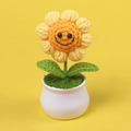 Close-up of handmade knitted sunflower in a white ceramic pot with cute smiley face detail - 1-Head Sunflower Smile Potted Plant