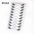 Detail of 10 pairs cat eye false eyelashes in white tray showing natural volume and curl - Curled Voluminous Style (XYJ13) / 10 Pairs Set