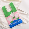 Knit tote bag with blue, green, and pink color blocking and white tulip flower pattern - Green-Tulip