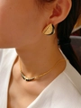 Close-up of vintage 18K gold earrings and necklace set with black enamel detail - E0918 Black Stud Earrings
