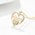 Close-up of golden heart pendant with MAMA lettering and sparkling zircon stones - Gold Heart Mama