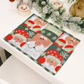 Knitted Christmas placemat with Santa Claus motif and Feliz Navidad text in red and green - Santa Claus