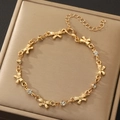 Elegant gold bow charm bracelet with sparkling crystal accents and adjustable chain - Gold Rhinestone Bow Bracelet (N-1088)