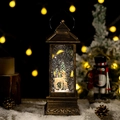 Vintage bronze Christmas lantern with deer scene, featuring glowing lights and falling snow - Elk