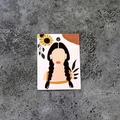 Macro shot of jewelry display card featuring floral woman illustration on concrete surface - Impression No.8 (100 Sheets)