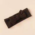 Close-up of a soft knitted dark brown baby headband with a fine texture bow design - Dark Brown
