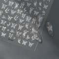Adesivi per unghie a farfalla olografica con stelle e cristalli su unghie grigio argento - Stile Stella Farfalla Aurora (CO-424)