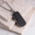 Detail shot of men's silver steel pendant with pavé black stones on beige stone base - Steel Color Black Zirconia Pendant + Steel Chain (60cm)