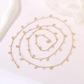 Detail of a gold body chain featuring hollow star pendants and clear crystal beads - Hollow Star Pendant 4mm Zirconia (Style 15) / Length approx. 1m