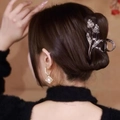 Detailed view of silver tulip hair claw with sparkling rhinestones worn on hair - Double Tulip Claw Clip Gun Black