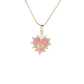 Collana a cuore dorata con occhio del male rosa e punte in zirconia su sfondo bianco - Rosa