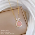 Macro view of pink crystal necklace with bow pendant and detailed size specifications - Bowknot Pink Necklace (A433)