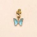Detailed close-up of a gold-toned braid hair ring with a blue crystal butterfly pendant - Blue Crystal Gold