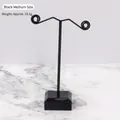 Medium T-shaped black metal earring stand with scroll design and stable base - M Black