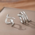 Snake shaped stainless steel open rings with detailed scale textures in silver finish - Silver