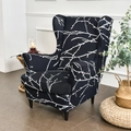 Elastic wingback chair cover featuring a white branch pattern on a black background - Hidden Fragrance Branch