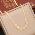 Golden herringbone chain necklace with six roman numeral cubic zirconia ring pendants - Necklace