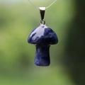 Lapis lazuli blue natural crystal mushroom pendant with metal bail on nature background - Blue Sodalite