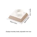 Adjustable white C-type bracelet display stand with square metallic base for jewelry - Slanted Square Bracelet Stand (White/Champagne)