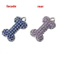 Detailed front and rear view of bone-shaped pendants with blue and purple crystals - Platinum Blue/Purple Zircon Bone