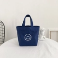 Minimalist navy canvas tote bag with a white smiley face print on a white tabletop - 7*17*20*26cm (No Inner Bag) / Navy Blue