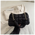 Detail of black quilted cloud bag with gold chain strap and fluffy texture design - Black