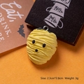 Detailed close-up of yellow resin mummy charm with dimensions 2.3cm by 2.8cm - Yellow Mummy