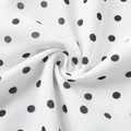 Macro shot of white fabric with black polka dots showing soft texture and fluid drape - S / White