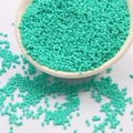 DIY handmade 2mm turquoise glass seed beads in a ceramic bowl for jewelry making - Light Peacock Green