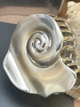 Detailed side view of high-gloss silver metal shell hair clip with smooth artistic finish - Silver