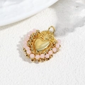 Detailed view of a gold heart pendant with crown decor and pink bead embellishments - Pink Beads/Gold