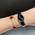 Women's black leather oval watch with silver case and red clover charm bracelet - Leather Strap / Silver Case/Black Strap