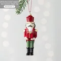 Schiaccianoci di Natale in resina con scatola regalo rossa e dettaglio nastro dorato - Schiaccianoci con scatola regalo
