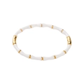 Detalle de brazalete estilo bambú en acero inoxidable con esmalte blanco y toques dorados - Blanco