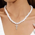 Close-up of a pearl necklace with a silver cross pendant inlaid with sparkling crystals - Silver Cross Pendant Pearl Necklace