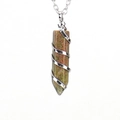 Macro view of unakite crystal hex prism with silver spiral wire wrap and cross chain - Silver Unakite