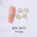 Vue macro de bijoux d'ongles en alliage doré avec perles et motif trèfle creux 3D - Noeud Papillon en Perle Doré (8875)