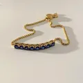Minimalist gold box chain bracelet with seven oval blue gemstones and adjustable clasp - Gold Blue Zirconia (SBK451)