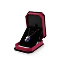 Octagonal red velvet jewelry gift box containing a gold clover pendant with blue stone - Large Pendant Box / Bordeaux With Black Interior