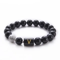 Minimalist black onyx and white turquoise bead bracelet with gold letter V charm - Letter V