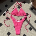 Hot pink smocked bikini set with halter top and high cut bottoms on a patterned rug - S / Top And Bottom / Rose Red