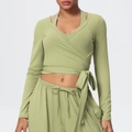 Detail of avocado green V-neck yoga set featuring cross-tie cropped top and wide-leg pants - Lime Green