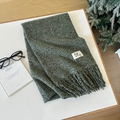 Thick dark green wool scarf with fringe and minimalist label in a cozy winter setting - 44 Calo Green / Over 175cm