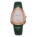Close-up of ladies fashion watch with emerald green leather strap and diamond-set bezel - Green