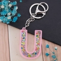 Pink resin alphabet U keychain with colorful glitter sequins and silver metal clasp - Letter U